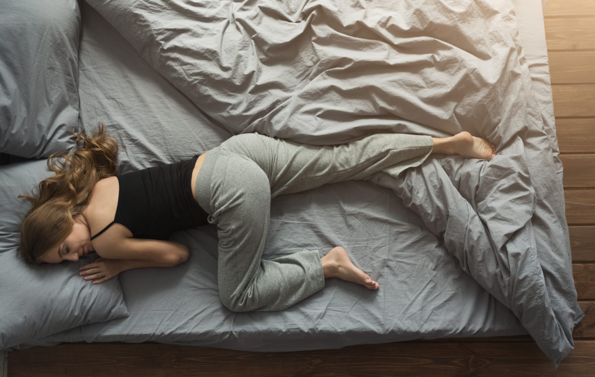 peaceful-woman-sleeping-in-bed-at-home-HPG43KN-1200x761.jpg